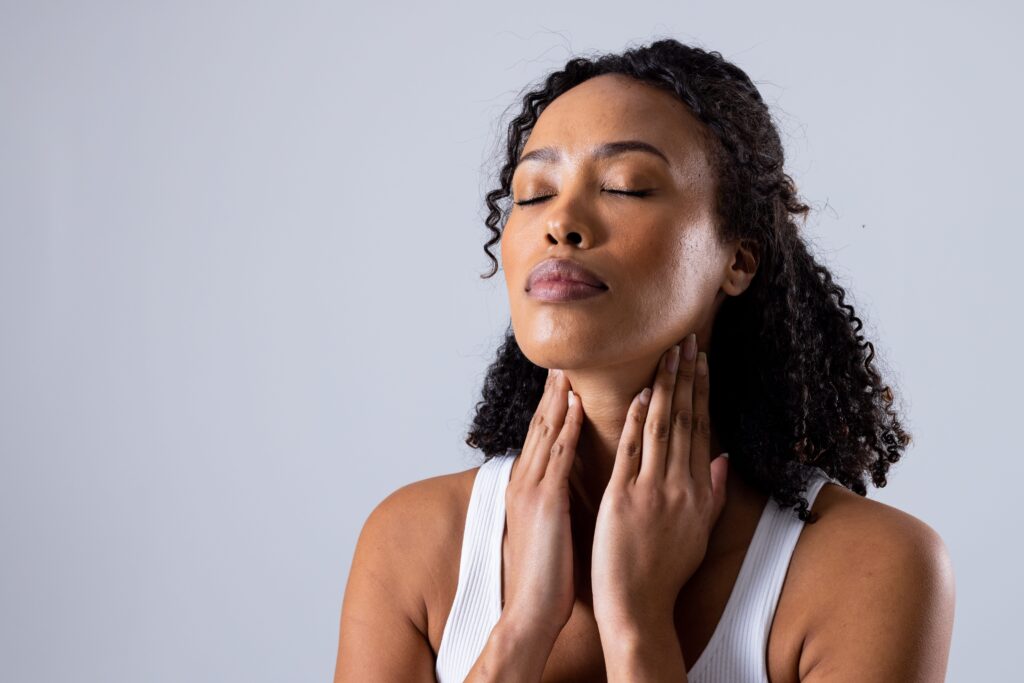 A women holding her neck