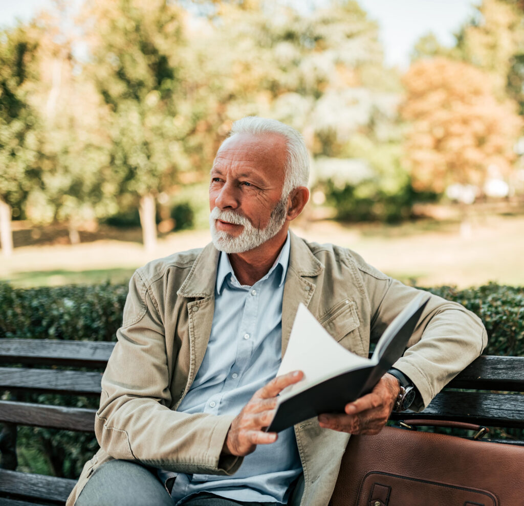 An old man reading a book